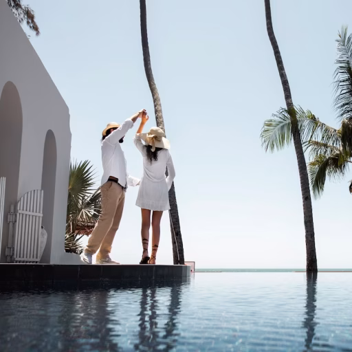 couple-dancing-by-pool-vacation_23-2149369707